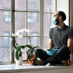 full-length-man-sitting-by-window-home