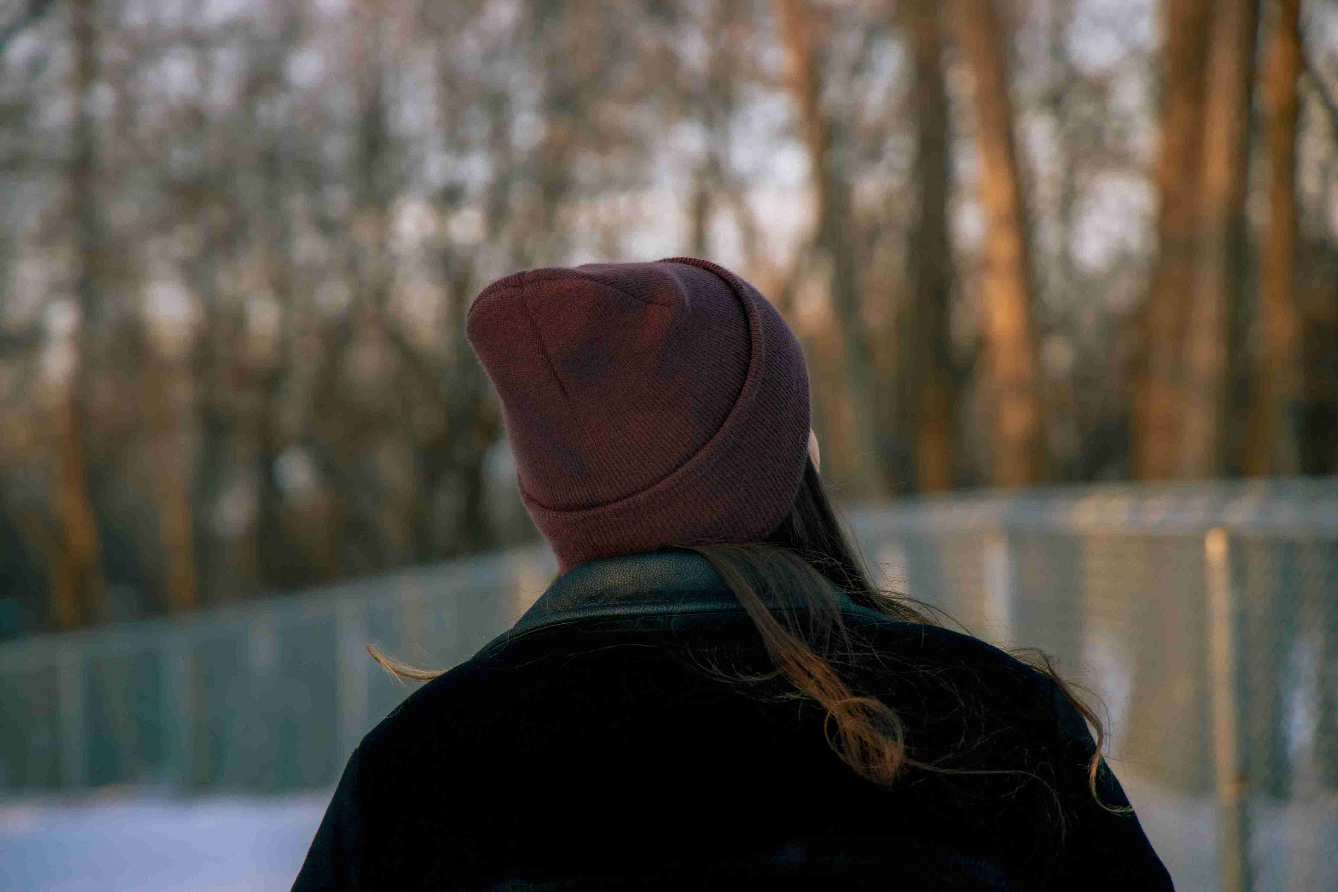 girl-with-hat-standing-forest-daytime_11zon