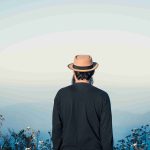 man-traveling-with-backpack-hiking-mountains_11zon