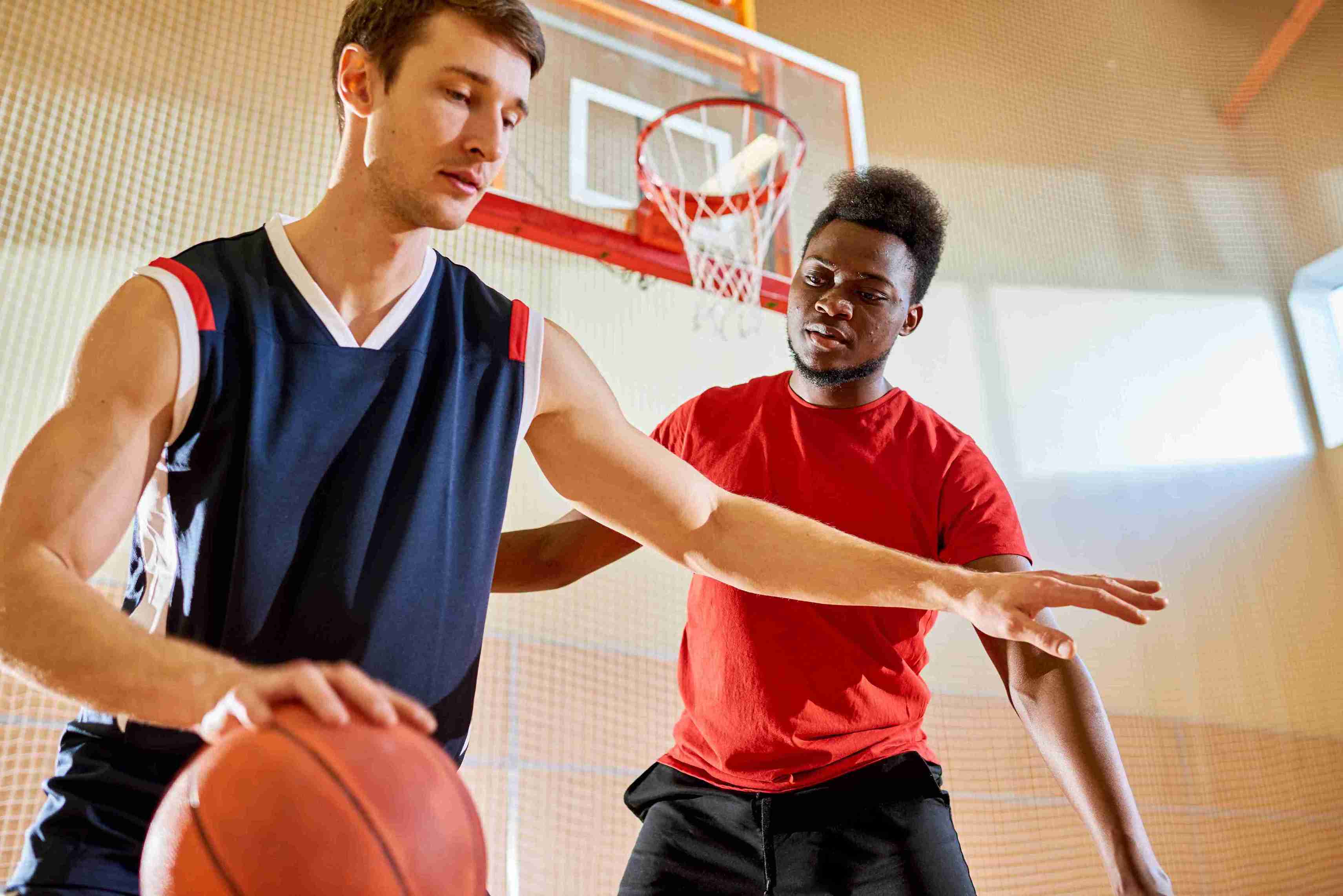 professional-basketball-player-dribbling-near-competitors-basket_11zon