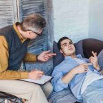 unhappy-male-patient-listening-psychologist-counselor-advice_11zon