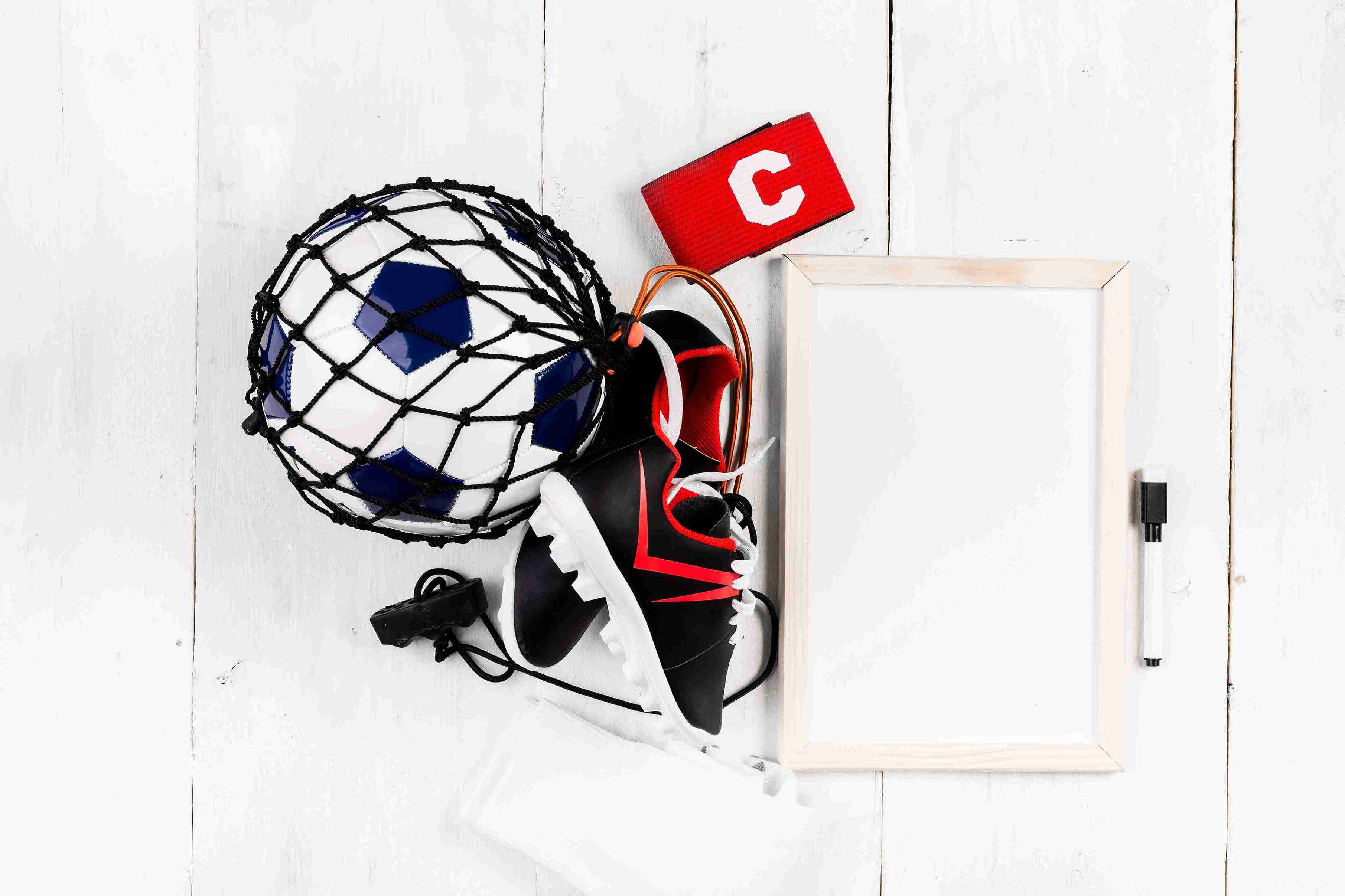 football-composition-with-whiteboard-ball-net_11zon
